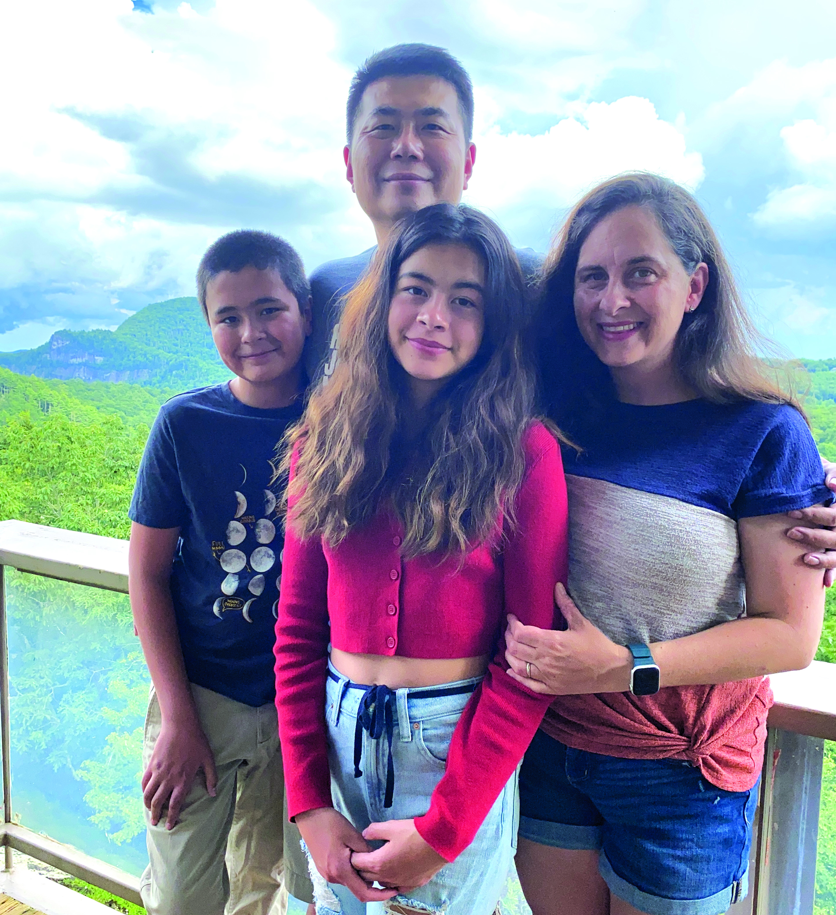Michael Ye was reunited with his family, from left, Micah, Anna Belle and wife, Melanie, on July 20.