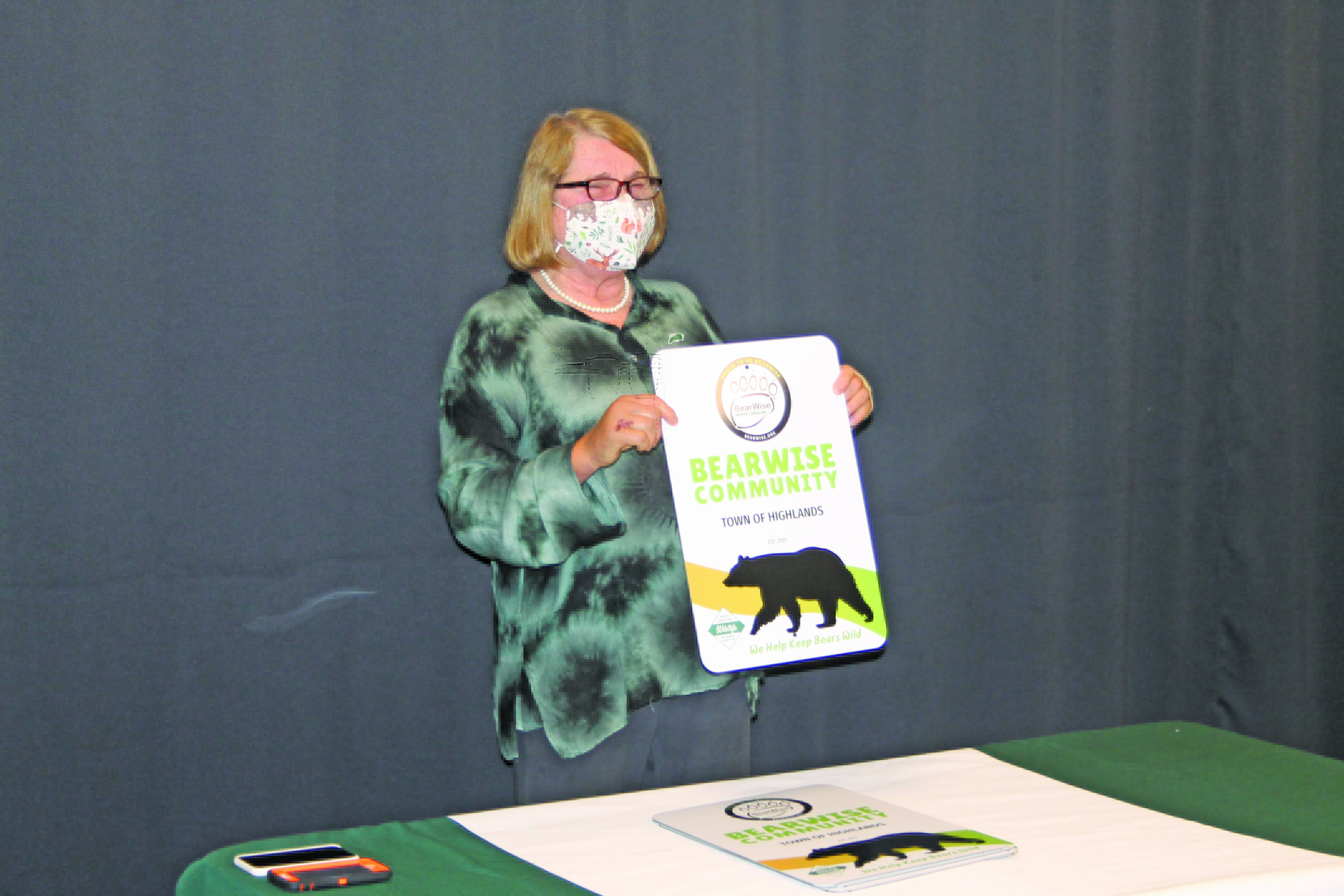 Photo by Christopher Smith/Staff BEAR task force director Cynthia Strain holds up the BearWise certified sign. 