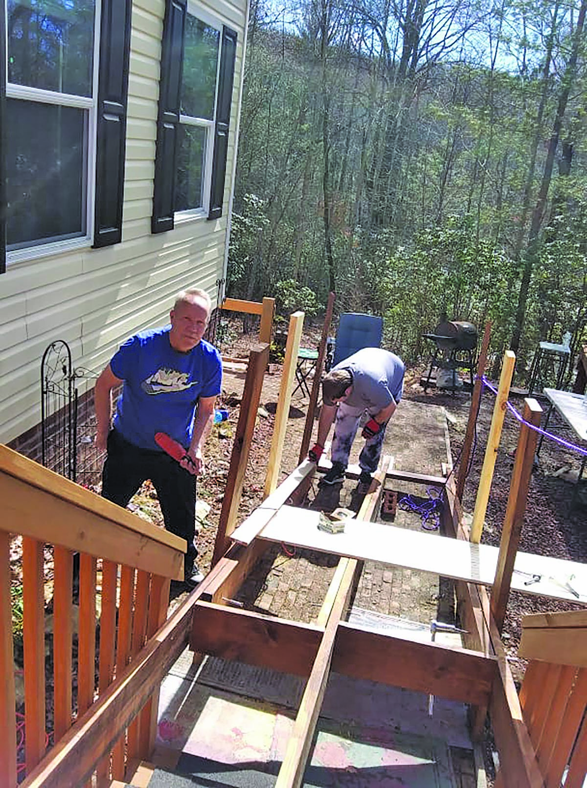 Submitted Photo Bruce and Brando Bird building a ramp to the Bird’s home in Highlands.