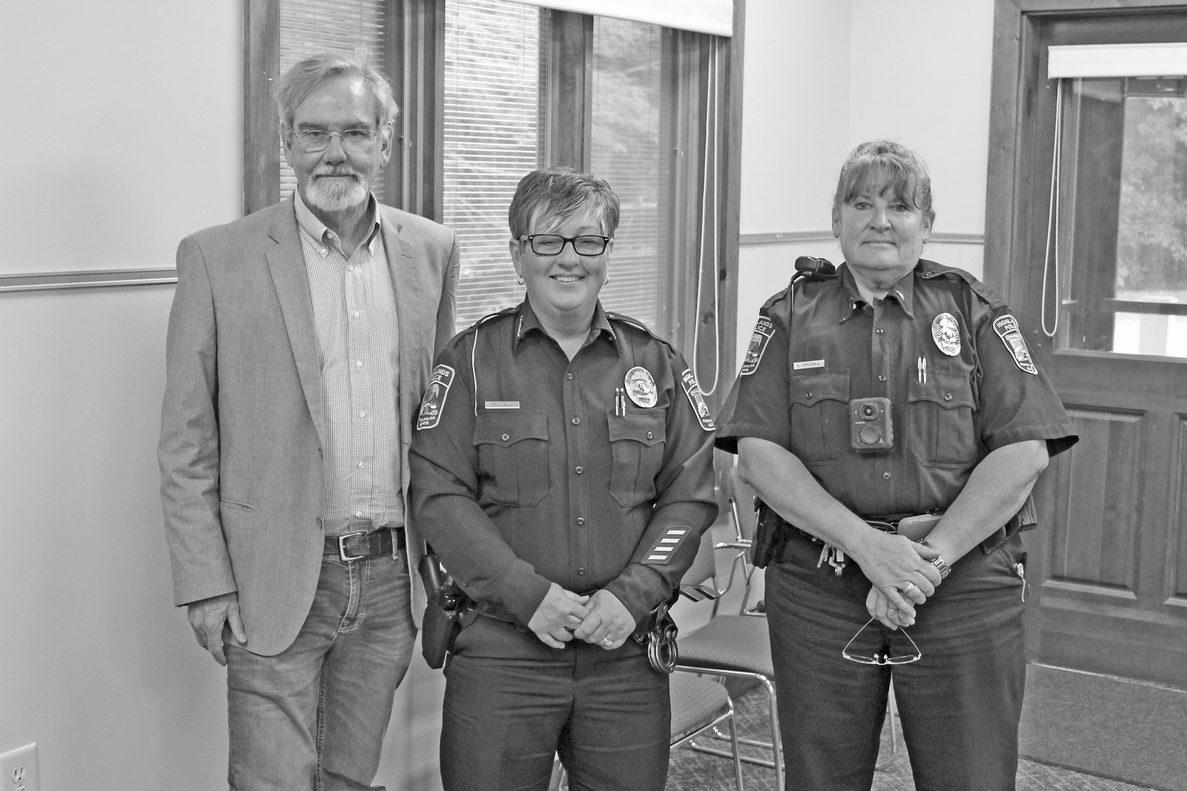 Photo by Christopher Lugo/Staff Highlands Mayor Patrick Taylor with HPD Chief Andrea Holland and Lt. Leah McCall at last week’s Community Coffee at Hudson Library. 
