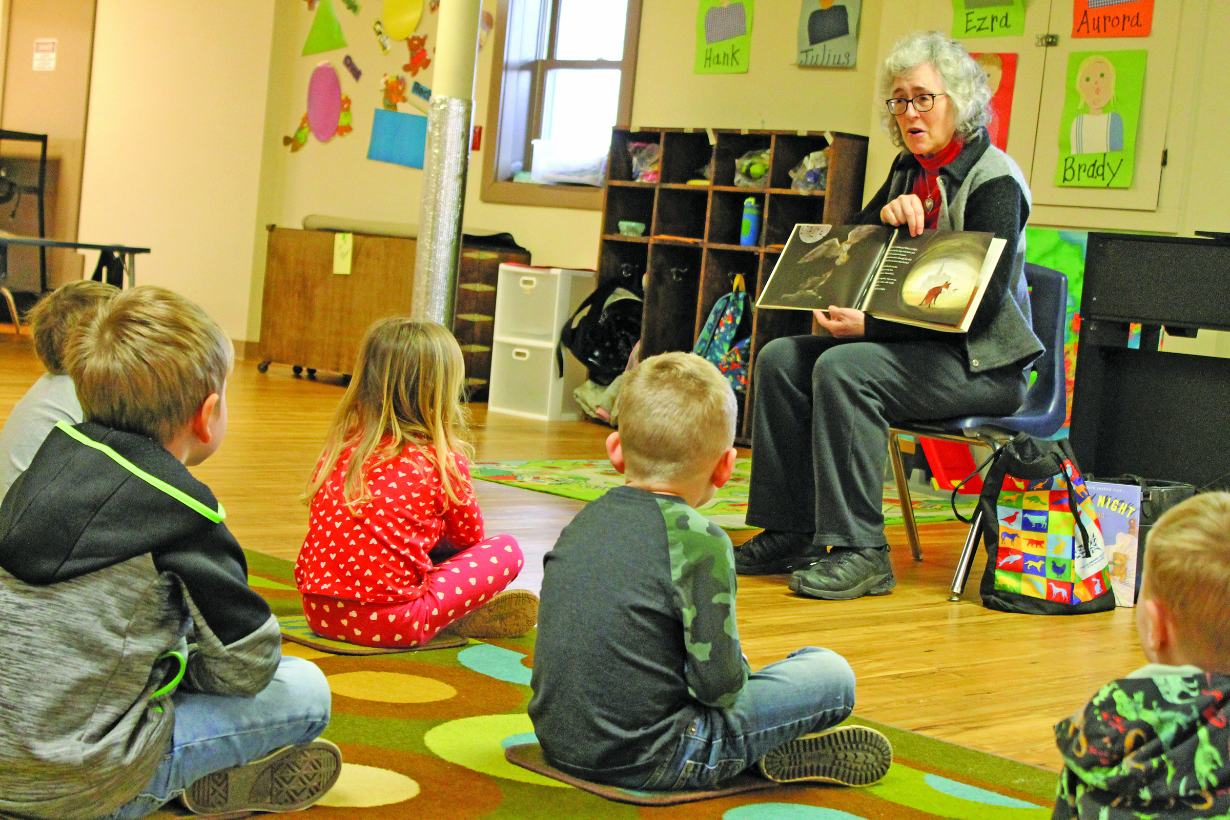 Photo by Christopher Lugo/Staff Hudson Library Librarian Carlyn Morenus reads to preschoolers at the Gordon Center. 
