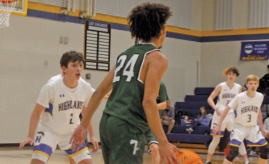 Highlands players do their best to play team defense against Tallulah Falls on Monday night.