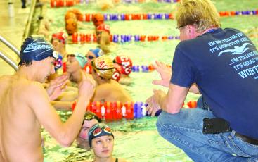 Coach Steve Hott gives his team instruction during the Clemson Aquatics Invitational.