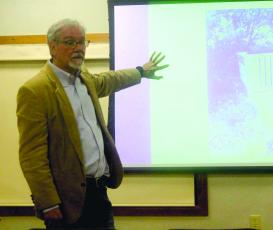Mayor Patrick Taylor discusses the town budget during his community coffee program at Hudson Library on Friday.