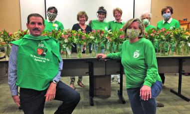 Highlands Cashiers Hospital CEO Tom Neal helped the the Mountain Garden Club assemble vases with fresh cut flowers for the HCH nursing staff.