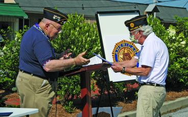 American Legion Post 370 commander Ed McCloskey presents Kenneth Knight with the 2020 Legionnaire of the Year award at Highlands Veteran’s Plaza on Saturday.