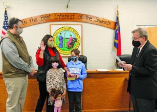 Hilary Wilkes takes her oath of office on Monday before joining the Macon County Board of Education as the board’s Highlands representative.