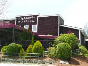 A grounds crew from Highlands Falls Country Club took time out to spruce up the exterior of Highlands Playhouse in March.