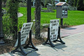 Informational signs regarding the Town of Highlands mask mandate are back in place at Kelsey-Hutchinson Founders Park.