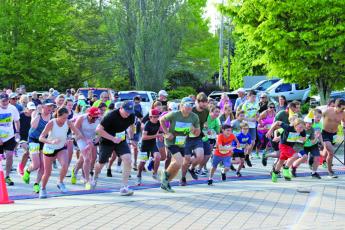 A group of 237 runners took off from the starting line at Kelsey-Hutchinson Founders Park for the annual Twilight 5K and 10K on Saturday night.