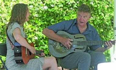 Frank and Allie play outside Hudson Library during the first ever Meander in May on Saturday afternoon.