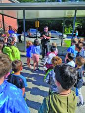 Two sheriff’s deputies visited students during the Highland’s School Summer Camp to teach about safety. 