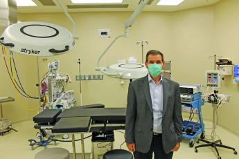 Highlands-Cashiers Hospital CEO Tom Neal stands in one of the two new operating rooms. 