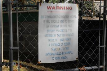 A sign posted on the fence outside the Big Bear Pen communication tower. 
