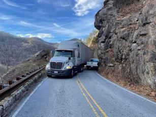 Submitted Photo A pick up truck tries to squeeze past a tractor trailer in the Cullasaja Gorge in December. 