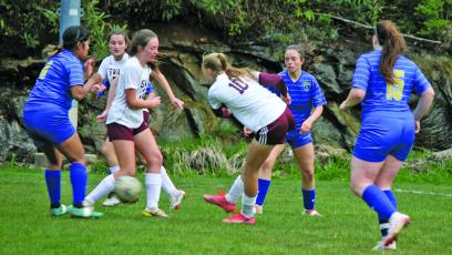 Highlands defenders smother Swain County forwards during their game on Friday night. Highlands won the game 4-1.