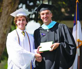 Jeb Bring, of Highlands, receives his diploma during Rabun Gap-Nacoochee School’s commencement ceremony on May 21.