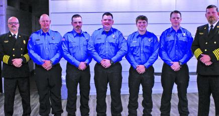 The five new full-time firefighters from Highlands Fire and Rescue were officially pinned on Thursday night during a town board meeting.