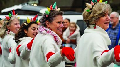 Members of the Mountain Garden Club have been performing a dance routine to kick of the Highlands Christmas Parade each year since 1998.
