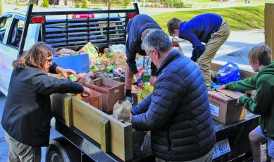 Students and volunteers from Summit Charter School delivered more than 3,000 food items to Fishes and Loaves Food Pantry in Cashiers following a food drive at the school. The middle school student council organized the food drive.