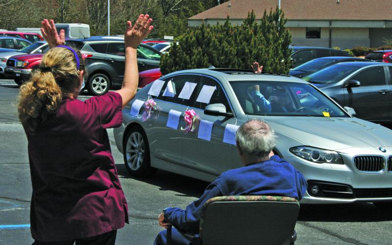 Residents and staff members of the Eckerd Living Center at Highlands-Cashiers Hospital lined up outside the facility on Tuesday for a parade of well-wishers, many of whom waved and offered personal messages from their vehicles in order to maintain social distance.