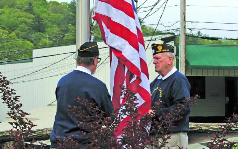 Members of Highlands American Legion Post 370 raise a new flag over the Veteran’s Plaza during the annual Memorial Day ceremony on Monday.
