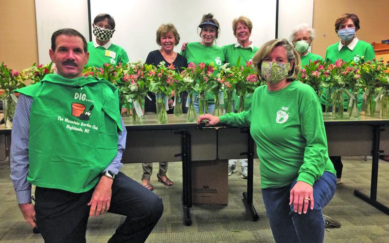 Highlands Cashiers Hospital CEO Tom Neal helped the the Mountain Garden Club assemble vases with fresh cut flowers for the HCH nursing staff.