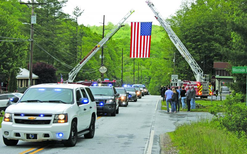 A line of emergency vehicles nearly a mile long escorted Macon County Sheriff’s Office corporal David Head’s body to Scaly Mountain Volunteer Fire Department where a celebration of life service was held on Thursday.