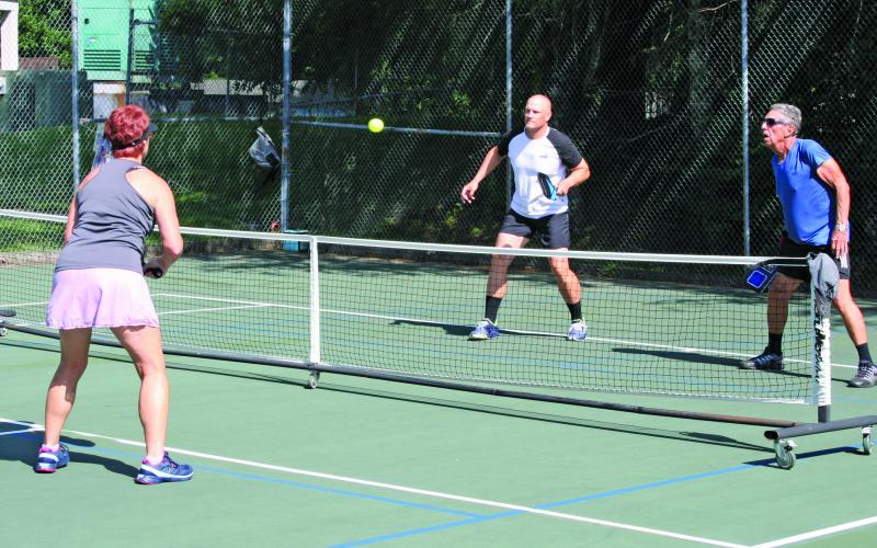 Pickleball players have been showing up early, and in high numbers, to get matches played before the summer sun raises the on-court temperature.