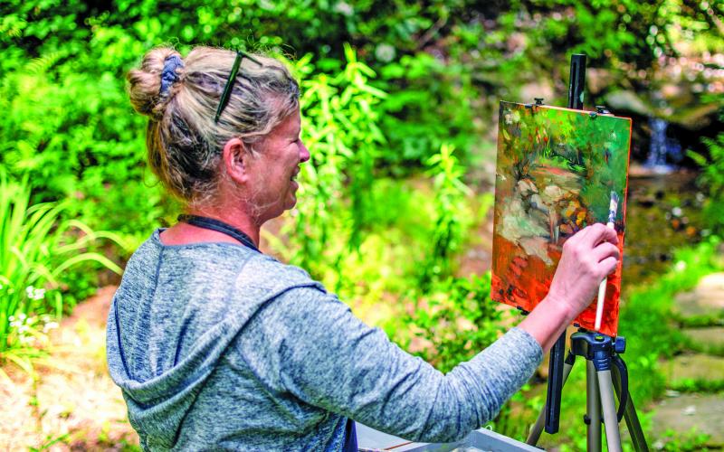 Madeline Dukes, a featured artist from Charleston, South Carolina, took advantage of perfect weather and beautiful scenery during the Cashiers Plein Air Festival held on July 15-19 at The Village Green.