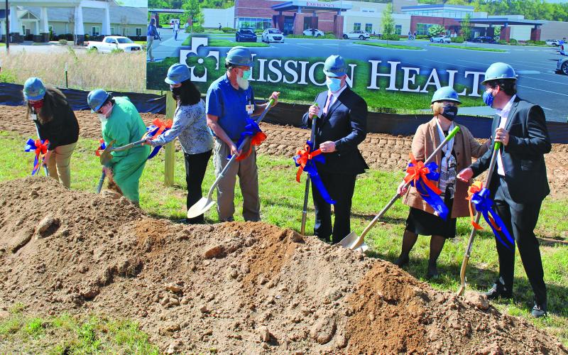 HCA officials turn up the first dirt at the future site of Angel Medical Center at One Center Court. From Left: Becky Dahl, Peggy Ramey, Leslie Vanhook, David Franks, Tim Layman, Karen Gorby, Johnny Mira-Knippel.