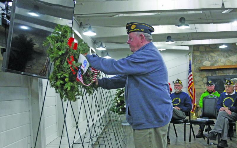 Photo by Christopher Lugo/Staff P.J. Pugh places a wreath in honor of the U.S. Marines Corp. 