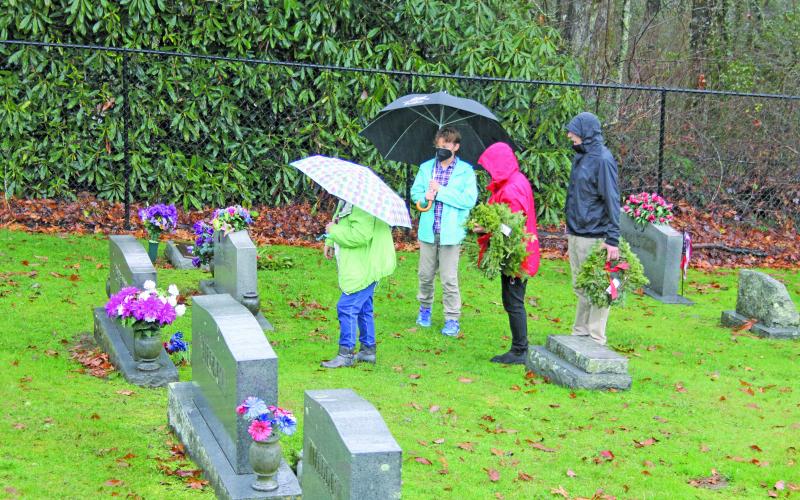 Photo by Christopher Lugo/Staff rain came down hard on Saturday at Highlands Cemetery.