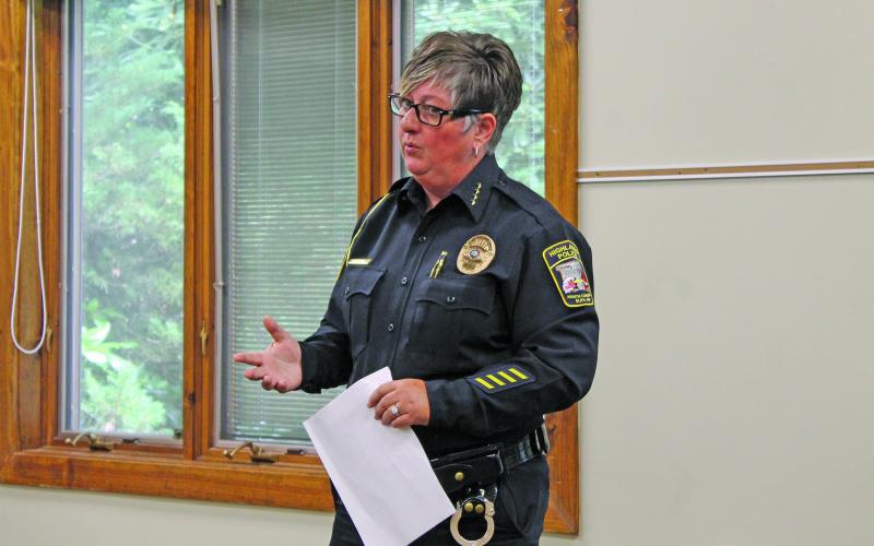 Photo by Christopher Lugo/Staff Highlands Police Chief Andrea Holland spoke during  the Community Coffee at Hudson Library last Friday. 