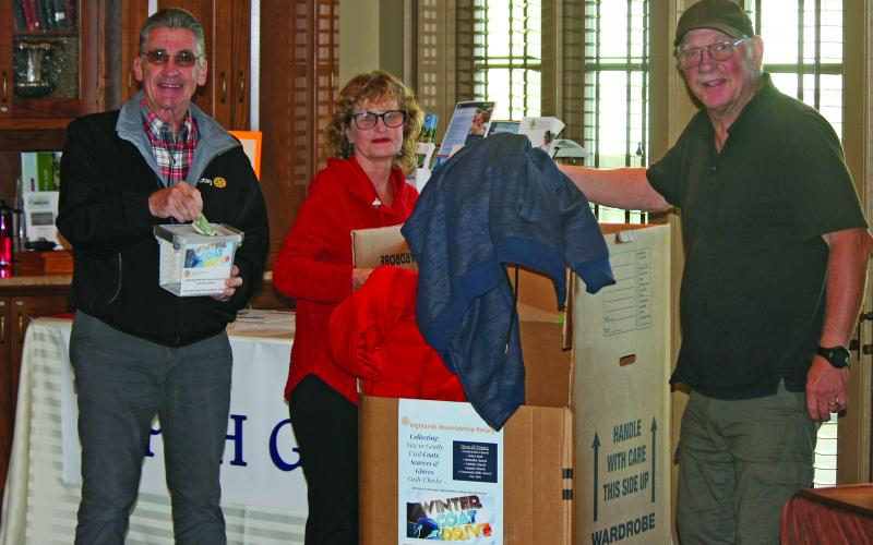 Members of the Mountaintop Rotary Club of Highlands placed the first donated coats in a drop box at First Presbyterian Church on Friday, Oct. 28.
