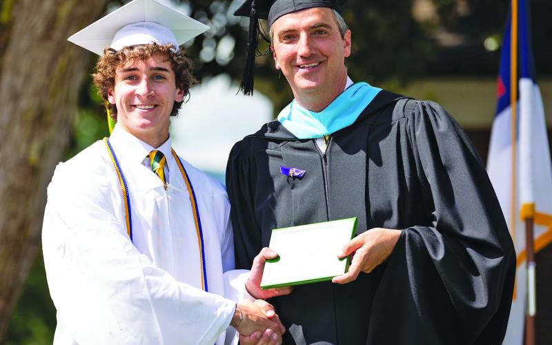 Jeb Bring, of Highlands, receives his diploma during Rabun Gap-Nacoochee School’s commencement ceremony on May 21.
