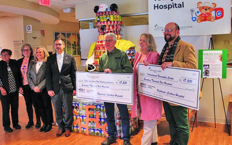 Representatives from Highlands Cashiers Hospital made donations of $17,500 to the food pantries in Highlands and Cashiers on Thursday.