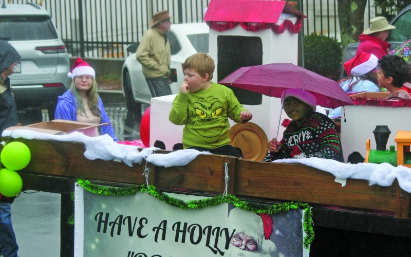 Photo by Ryan Hanchett/Staff Students from The Literacy and Learning Center in Highlands manned a reading themed float for the Olde Mountain Christmas Parade on Saturday in support of Dolly Parton’s Imagination Library.