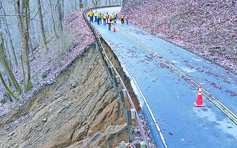 NC Department of Transportation crews assess 80-feet of washed out shoulder along US 64 in the Cullasaja Gorge.