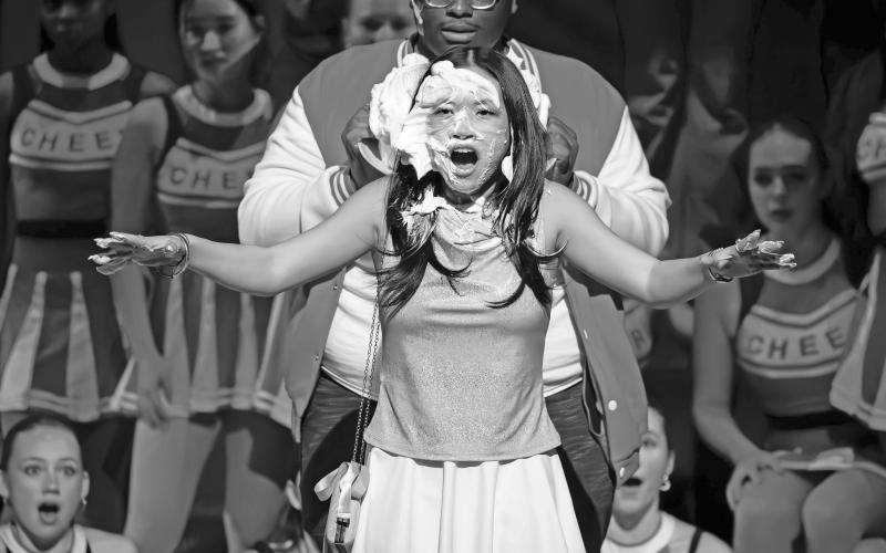 Sharpay, played by Sophia Moore of Highlands, gets a crème brûlée to the face, courtesy of Zeke, played by Uly Kunaiyi-Akpanah of Abuja, Nigeria, in Rabun Gap’s production of “High School Musical.”